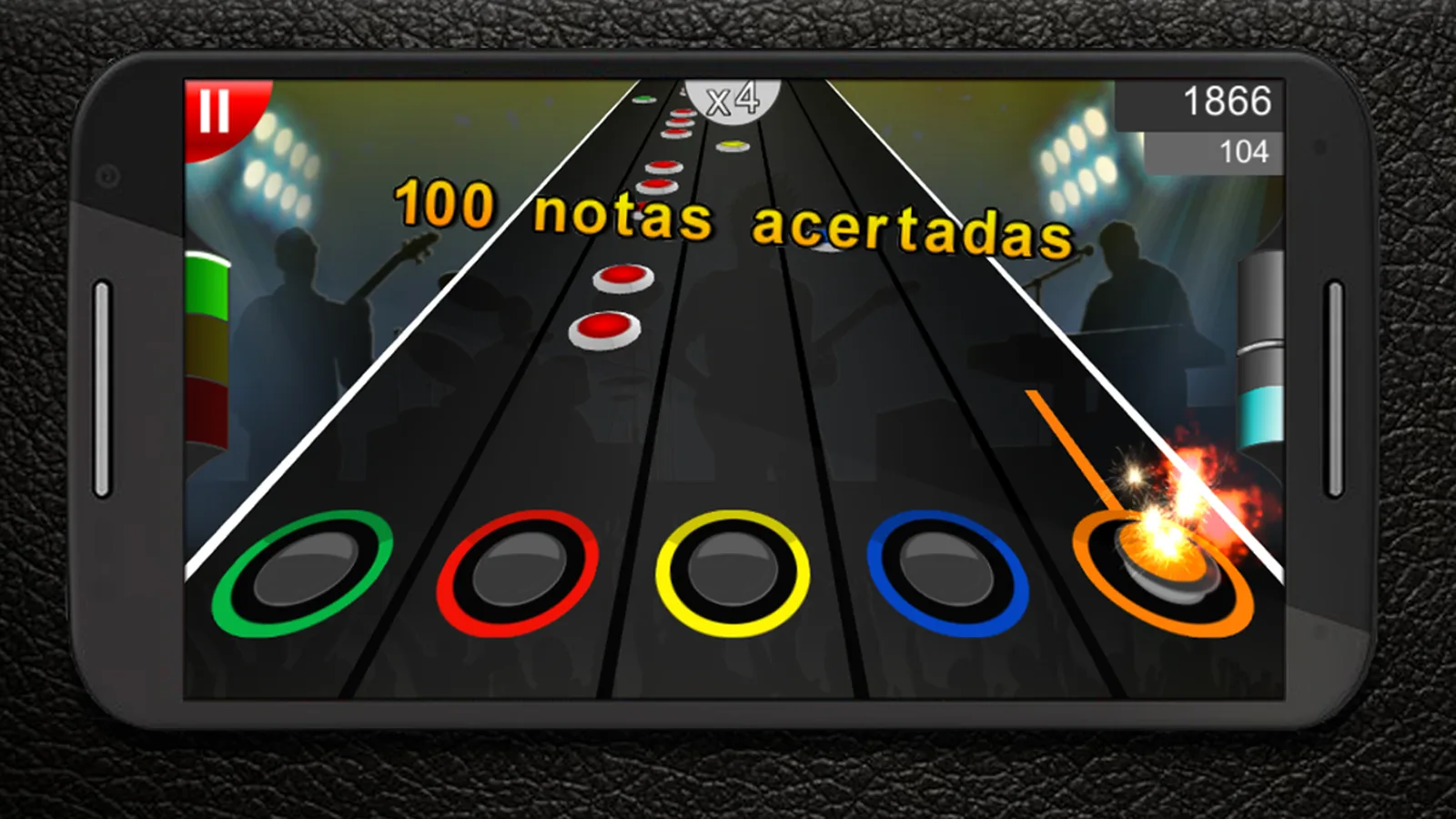 Partida de Guitar Flash: as notas descem pelo braço da guitarra até às cinco casas coloridas